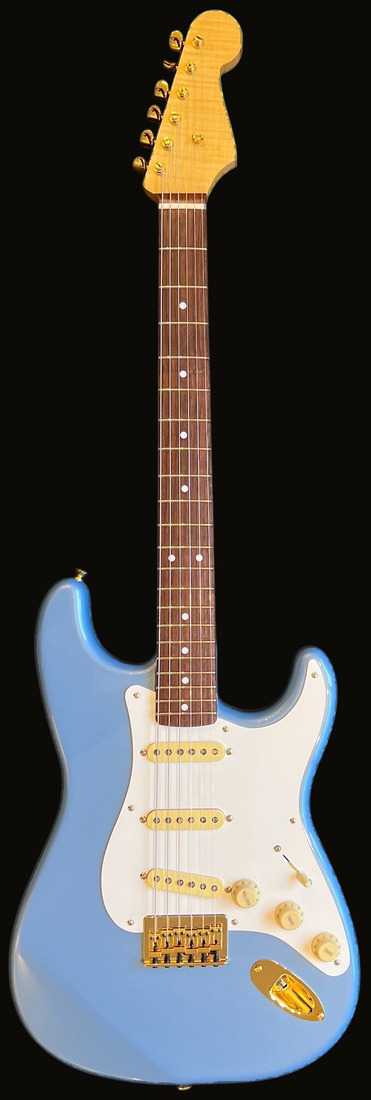 S-style in Pelham Blue, gold hardware, flame maple headstock — front
